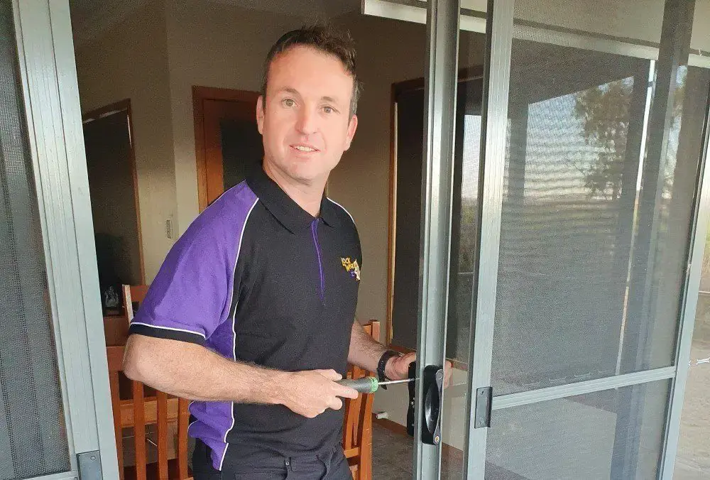Lockwise locksmith repairing a sliding glass door lock